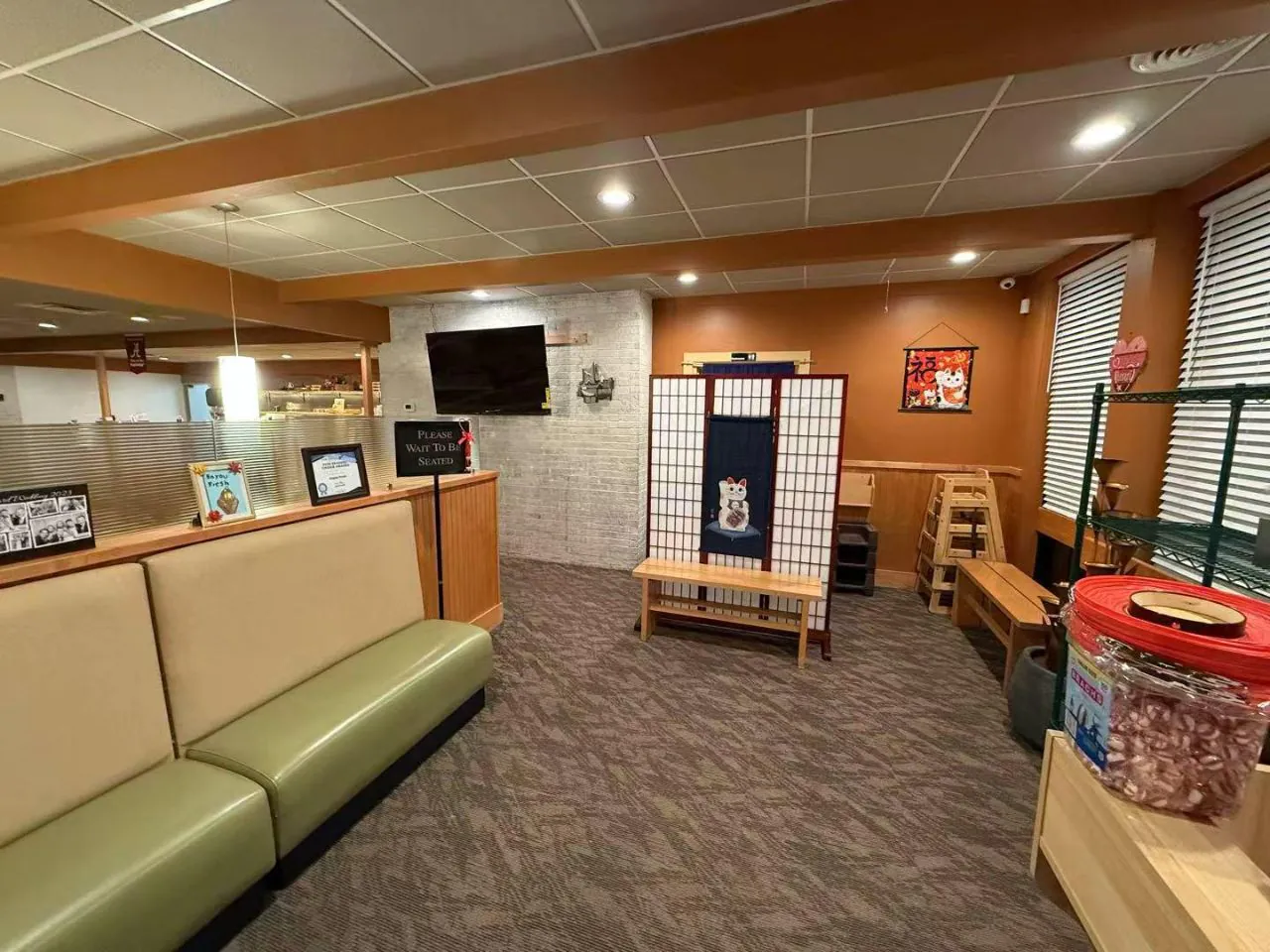 Cozy waiting area with booth seating and Japanese-style decor at Bayou Fresh Seafood Grill & Sushi a Asian Fusion Restaurant in Jasper